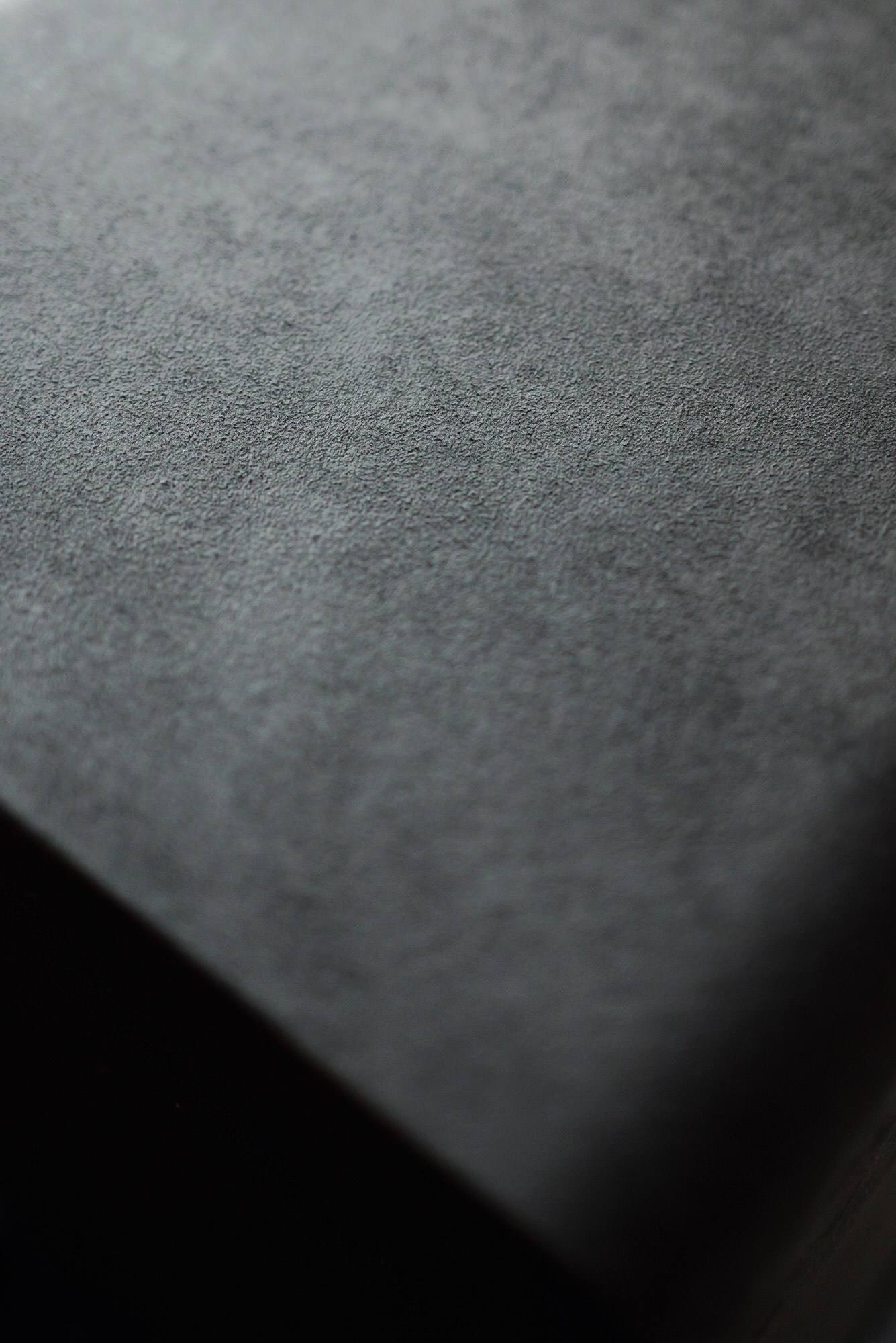 Close-up of black Alcantara leather texture finish